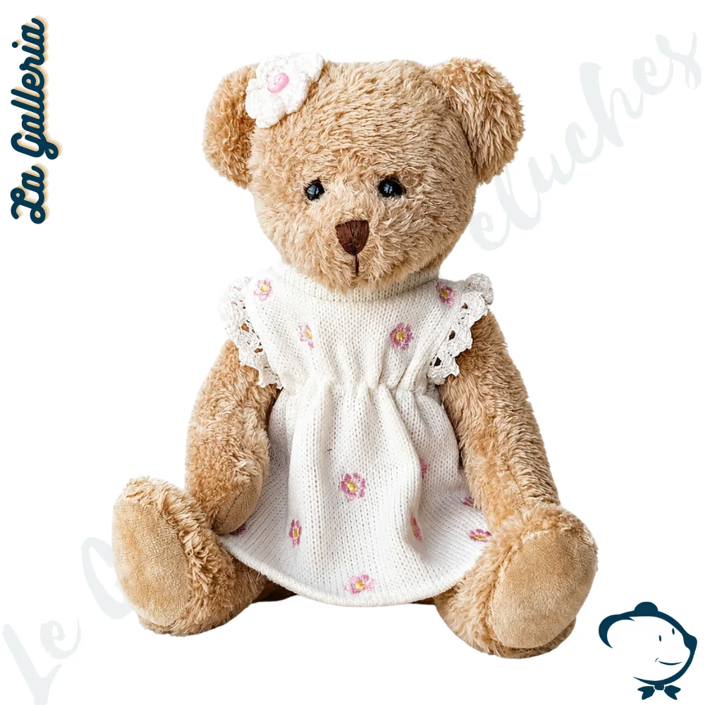 Peluche ours Cylia La Galleria avec robe blanche fleurie et fleur assortie à l’oreille