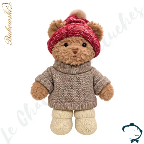 Peluche ours Matt Bukowski 25 cm avec pull gris taupe chiné, bonnet rouge à pompon et bottines écrues.