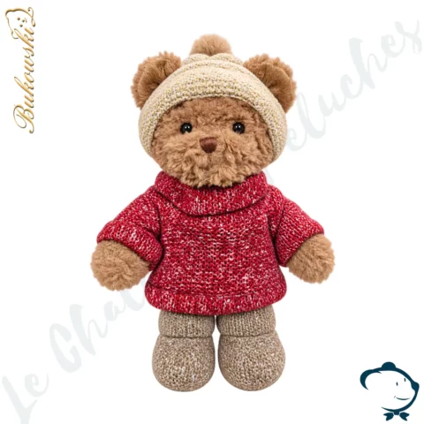 Peluche ours Steve Bukowski 25 cm avec pull crème chiné, bonnet gris taupe à pompon et bottines rouges.